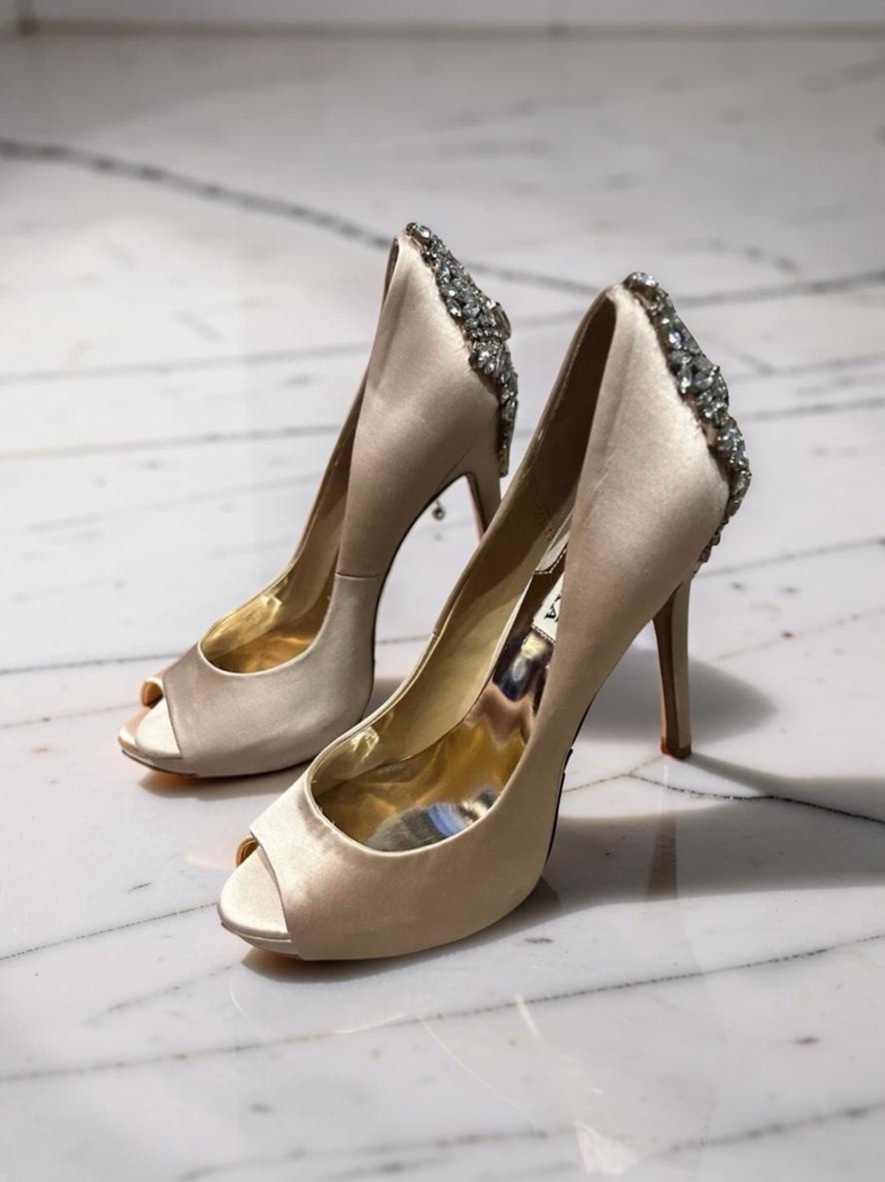 Badgley Mischka Kiara peep-toe pumps, featuring a prominent crystal-embellished